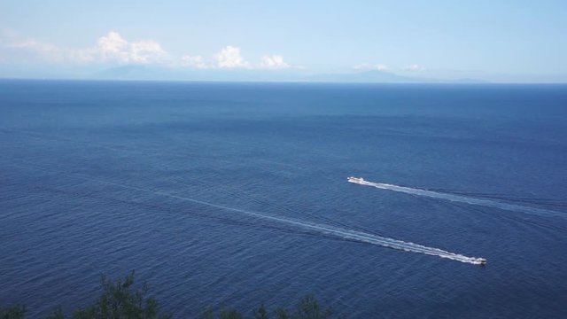 Pan right, boats off coast of Praiano