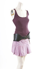 Dark top and purple mini skirt summer spring wear on mannequin full body shop display. Woman fashion styles, clothes on white studio background.
