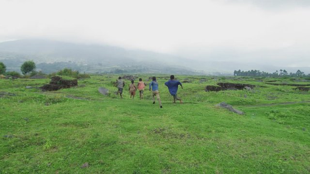 African children running on a field