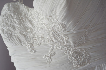 Detail of lace and embroidery in a bride dress
