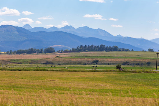 Mountains, hills, and fields in rural Montana.
