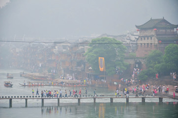 HUNAN, CHINA - JUNE 16, 2014 : Old houses in Fenghuang county in Hunan, China. The ancient town of...