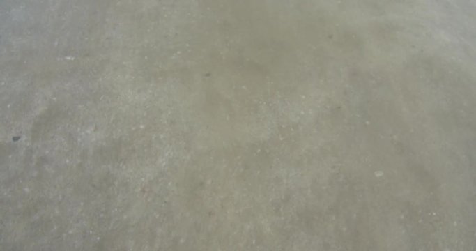 Seawater waves and sand beach Waves gently wash up onto the beach