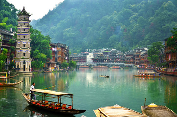 HUNAN, CHINA - JUNE 16, 2014 : Old houses in Fenghuang county in Hunan, China. The ancient town of...