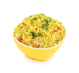 Indian Breakfast Dish Poha Also Know as Pohe or Aalu poha made up of Beaten Rice or Flattened Rice. The rice flakes are lightly fried in oil with mustard, chilly, onion, curry leaves and turmeric
