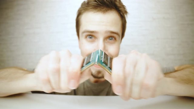 Person break a ram memory chip in slow motion 4K