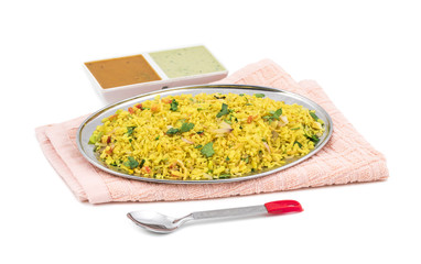 Indian Breakfast Dish Poha Also Know as Pohe or Aalu poha made up of Beaten Rice or Flattened Rice. The rice flakes are lightly fried in oil with mustard, chilly, onion, curry leaves and turmeric