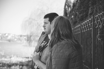  Overweight couple in park on sunny day. Concept of young plump people 