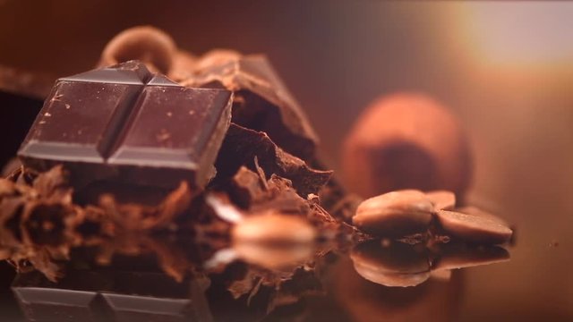 Chocolate. Assorted chocolate sweets and candies over dark background. Confectionery. 4K UHD video 3840X2160