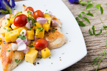 Clean food, Grilled chicken breasts , mango , tomato and vegetables.