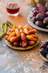 Set of various of dried dates or kurma in a vintage plates.