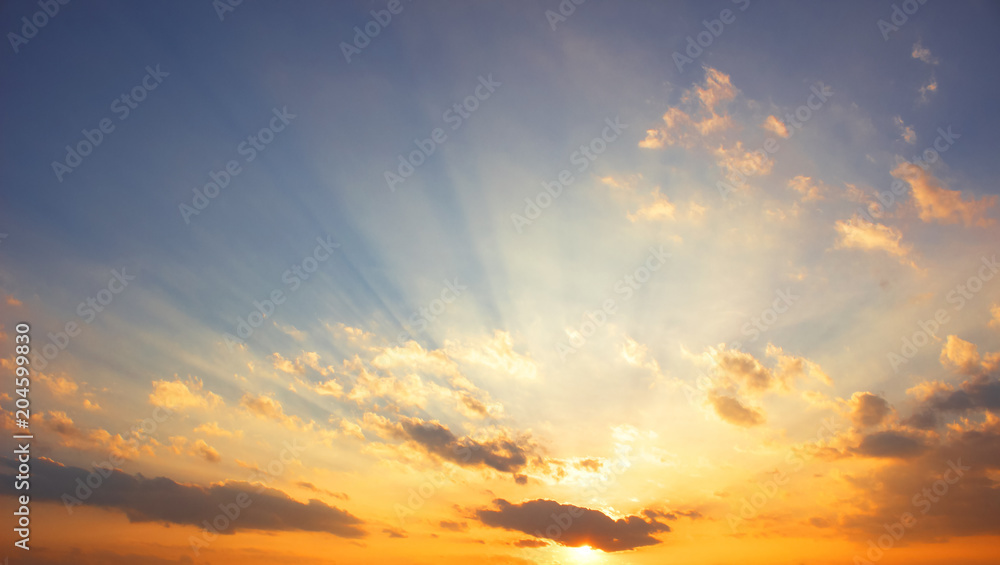 Wall mural background of colorful sky concept: dramatic sunset with twilight color sky and clouds.