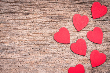 Red heart made from wood on wooden background