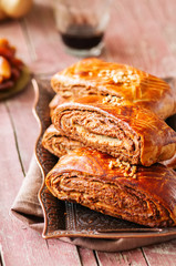 Traditional turkish pastry roll with chocolate and nuts filling - pastich served on a vintage tray.