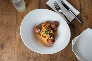 Spaghetti pasta with meatballs and tomato sauce flat lay