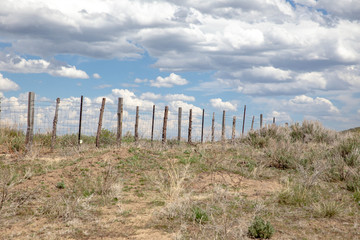 Fototapeta na wymiar Fence Line in High Desert Area