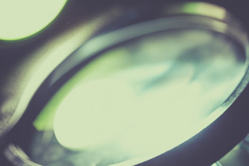 Ray of lamp spot lens light over black background, square stage abstract illumination