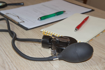 Doctor's stethoscope on the table. doctor workplace with a stethoscope at table