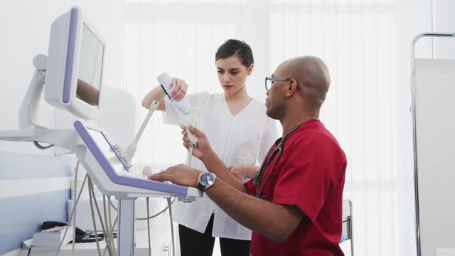 Doctor and nurse working with an ultrasound scanner