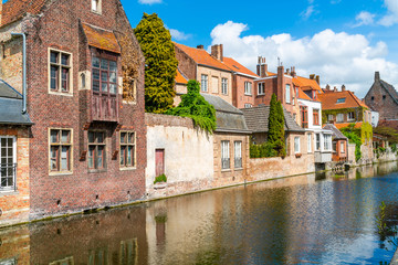 Fototapeta na wymiar View of a canal and old colorful buildings in Bruges, Belgium