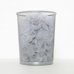 SILVER METAL WASTE PAPER LITTER BIN ISOLATED ON WHITE BACKGROUND