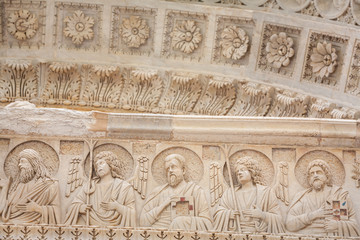 Art details on the Pisa Baptistery of St. John, Roman Catholic ecclesiastical building in Pisa, Italy.