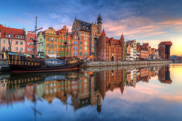 Fototapeta premium Beautiful old town of Gdansk reflected in Motlawa river at sunrise, Poland.