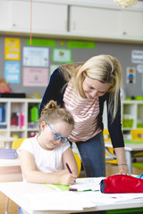 beautiful teacher helps her student to learn