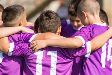 Kids soccer football -  children players celebrating after victory