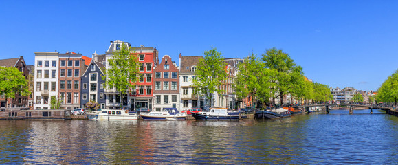 Panorama View Of Houses Near Canals In Amsterdam