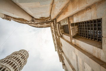 Obraz premium Pisa Cathedral, Roman Catholic cathedral dedicated to the Assumption of the Virgin Mary and the Leaning Tower of Pisa, bell tower of cathedral in Pisa, Italy.