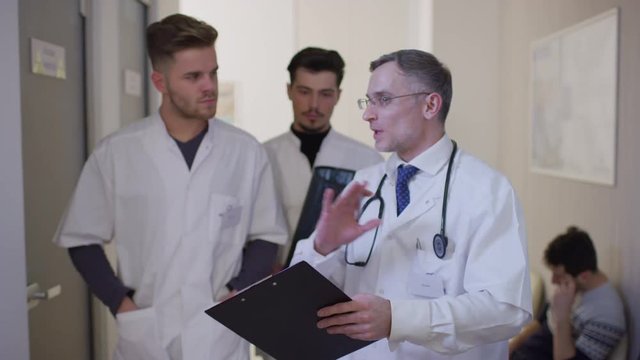 Doctor and residents talking