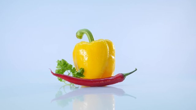 yellow papper and chili, lie on white background