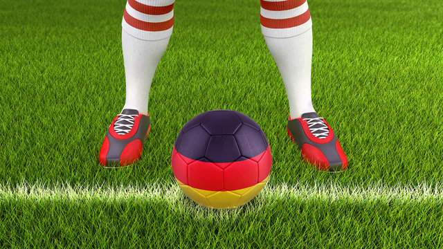 Man and soccer ball  with German flag 