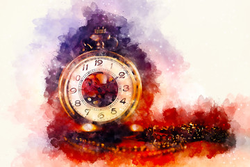 Vintage pocket watch and softly blurred watercolor background.