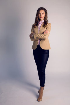 portrait of business woman in brown full length jacket