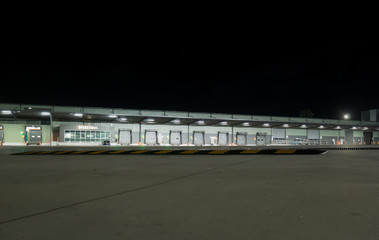 Fototapeta premium Industrial Warehouse at Night