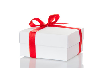 Christmas white gift box with red bow isolated on white
