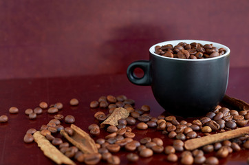 coffee beans, black Cup and cinnamon