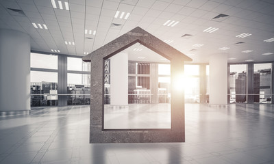 Conceptual background image of concrete home sign in modern offi