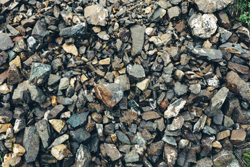 Closeup gravel surface wet old marble stone. Rock texture background