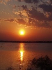 beauty in Nature cloud - sky idyllic lake Nature no people non-urban scene orange color outdoors Reflection scenics - nature sky sun Sunlight sunset tranquil scene Tranquility water waterfront