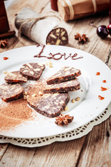chocolate sausage on a wooden table
