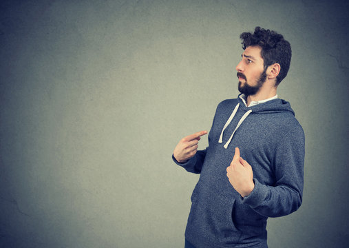 man pointing fingers at himself being in denial