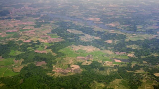 A view of the Earth from a great height. fields and forests