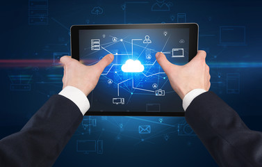 First person view of a hand using tablet with cloud office concept

