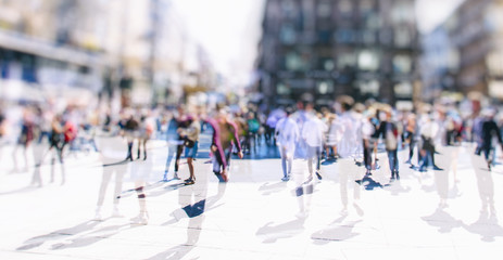 Crowd of anonymous people walking on busy vienna city street