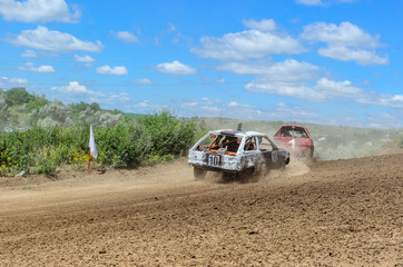 Race of the old wrecked cars. Rally on the open air with dust
