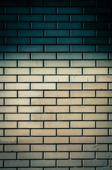 Fototapeta na wymiar Brick wall texture of yellow stone blocks closeup