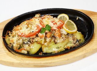 Grilled salmon and river perch with mushroom julienne, potatoes, tomatoes and cheese